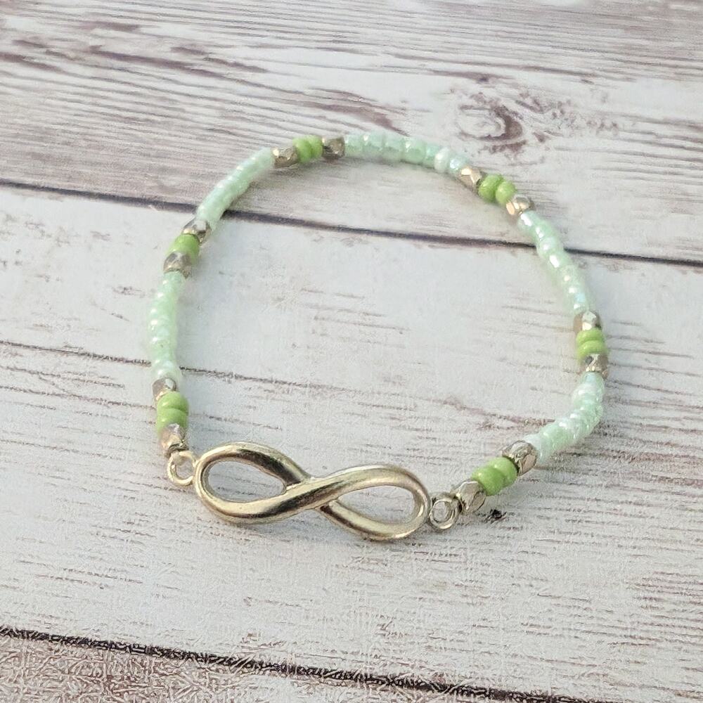 Dainty Bracelet Green Seed Beads with Gold Tone Infinity Symbol